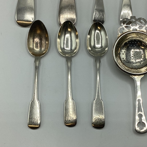 23 - A collection of sterling silver flatware together with a silver tea strainer. 363g.