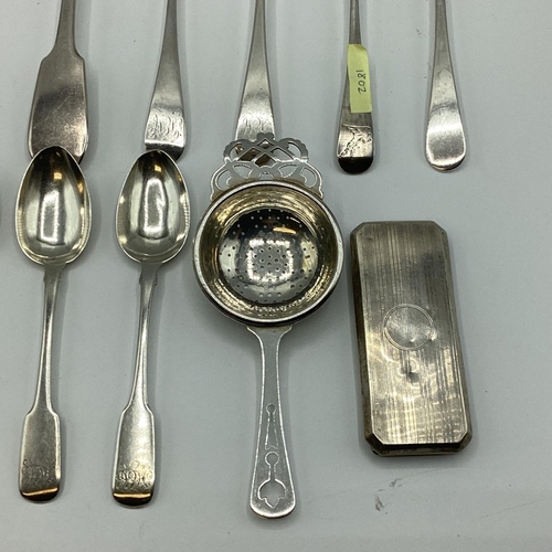 23 - A collection of sterling silver flatware together with a silver tea strainer. 363g.