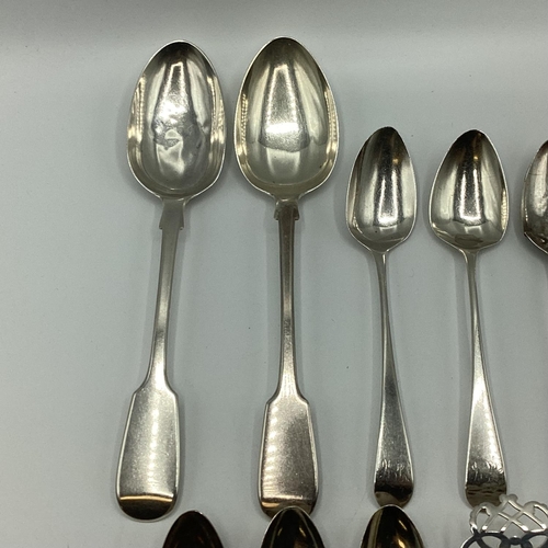 23 - A collection of sterling silver flatware together with a silver tea strainer. 363g.