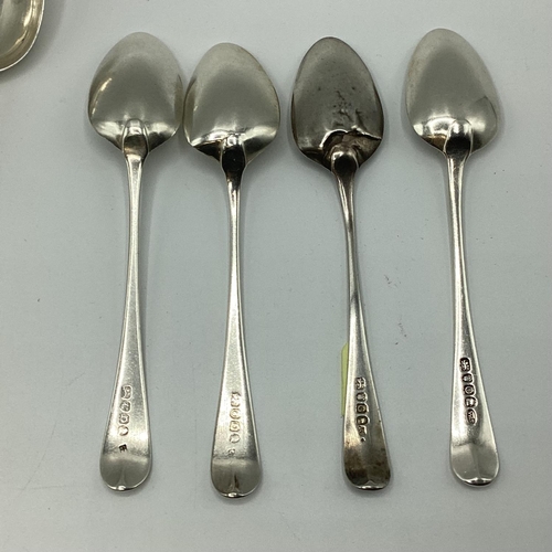 23 - A collection of sterling silver flatware together with a silver tea strainer. 363g.