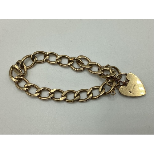 28 - A 9 ct gold flat link charm bracelet with A 9ct gold heart locket together with 10 9 ct gold and unm... 