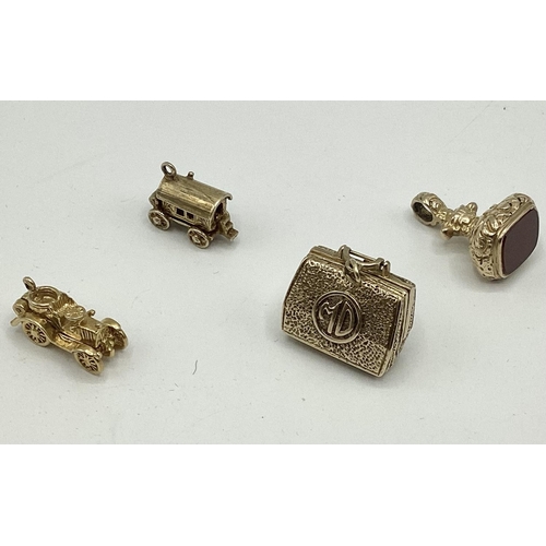 29 - 4 x 9ct gold charms to include Gladstone doctor's bag with separate tools and instruments, yellow me... 