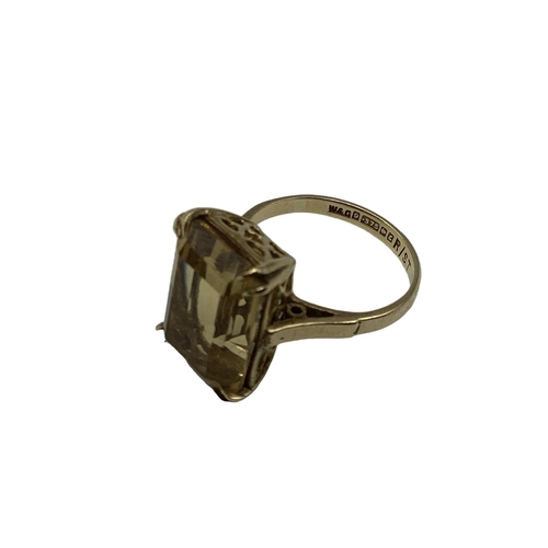 30 - A 9 ct gold and Citrine set ring Emerald cut citrine in 4 claw setting in open work mount, 3.8 g siz... 