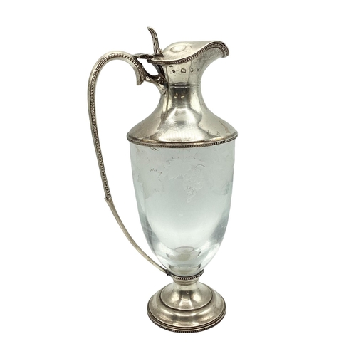 4 - A sterling silver claret jug with etched leaf and vine decoration. JM London, 1998. 26cm(h)