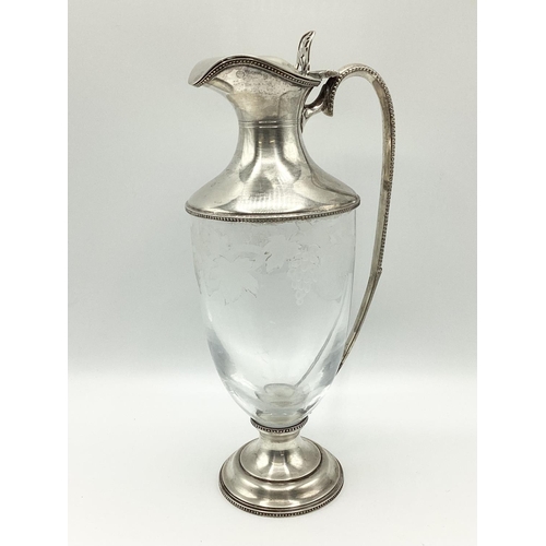 4 - A sterling silver claret jug with etched leaf and vine decoration. JM London, 1998. 26cm(h)