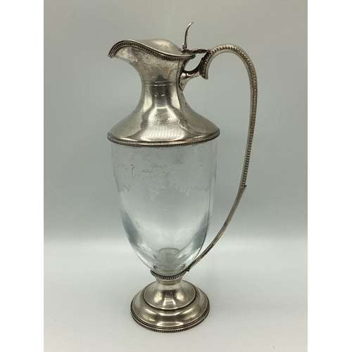 4 - A sterling silver claret jug with etched leaf and vine decoration. JM London, 1998. 26cm(h)