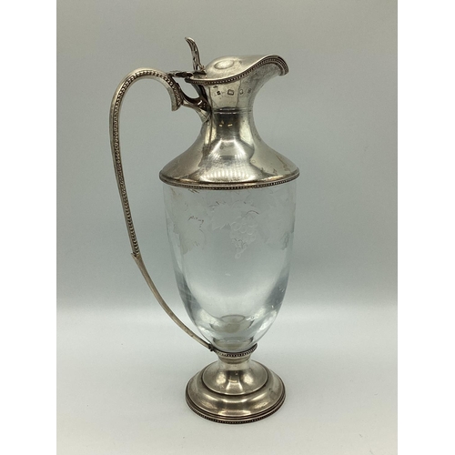 4 - A sterling silver claret jug with etched leaf and vine decoration. JM London, 1998. 26cm(h)