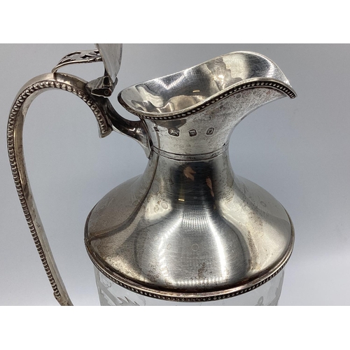 4 - A sterling silver claret jug with etched leaf and vine decoration. JM London, 1998. 26cm(h)