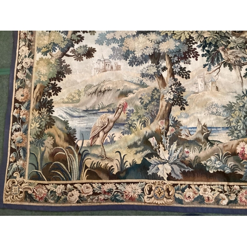 401 - C19th wall tapestry, continental landscape scene with floral border 225 cm x 175 cm