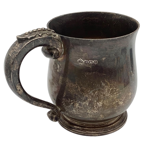 41 - A sterling silver mug, loop handle and circular stepped base by Elkington and Co Birmingham 1931, 46... 