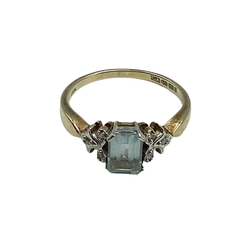 45 - A 9 ct gold aquamarine and diamond chip dress ring, central Emerald cut aquamarine 5mm x 3.5 mm, 2.5... 