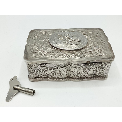 5 - A continental silver automaton singing bird music box. Scrolling leaf decoration. Marked ES 925 ster... 