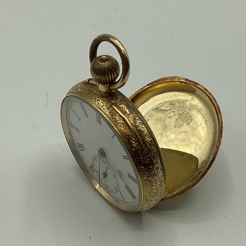 51 - An 18 ct gold ladies crown wind pocket watch, open 24 mm face, Roman numeral markers and second subs... 