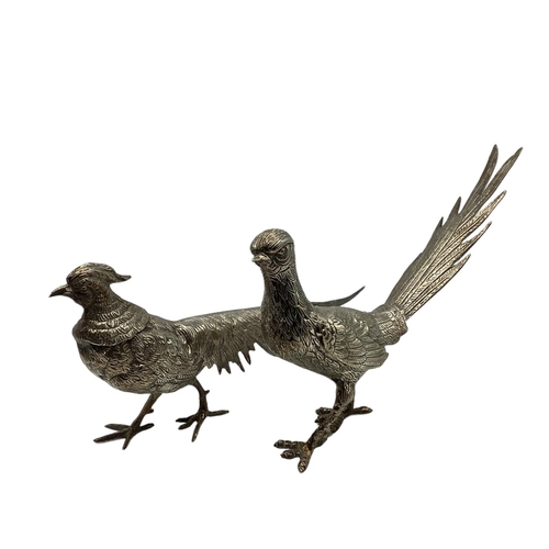 61 - Pair of white metal Pheasant ornaments .  Circa 30 cm L