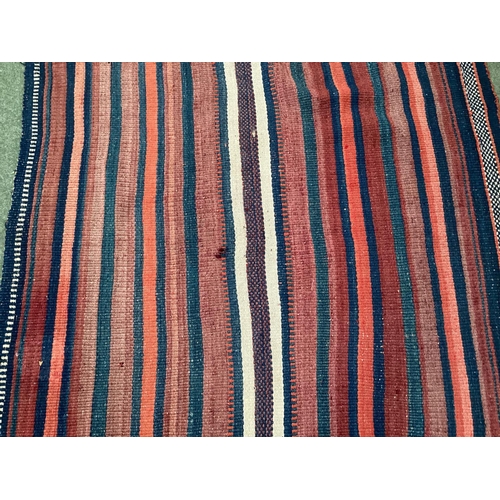 638 - A Kilim style runner, the red and blue stripes and kilim stylized pattern to end of the rug, 109/344... 