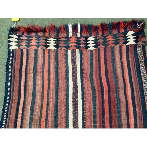 638 - A Kilim style runner, the red and blue stripes and kilim stylized pattern to end of the rug, 109/344... 