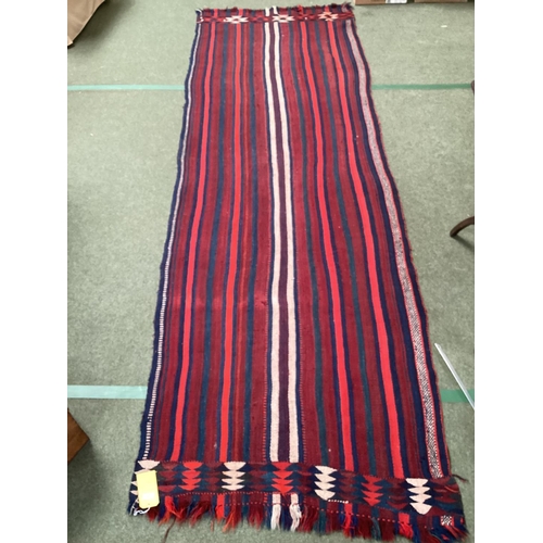 638 - A Kilim style runner, the red and blue stripes and kilim stylized pattern to end of the rug, 109/344... 