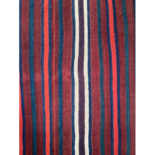 638 - A Kilim style runner, the red and blue stripes and kilim stylized pattern to end of the rug, 109/344... 