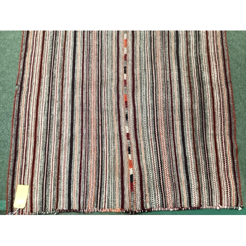 639 - A Kilim style rug/runner with all over stylized reds and greys stripes, 133/310cm