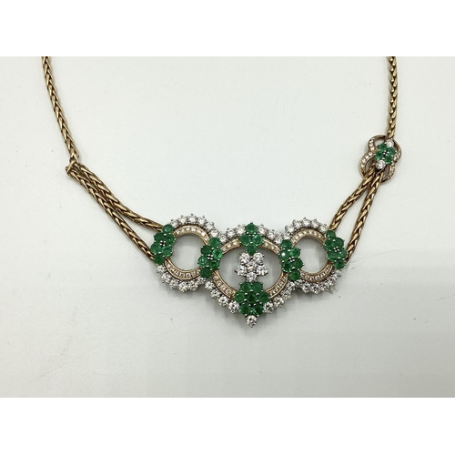 7 - An 18ct gold Emerald and diamond necklace. Retailed by Asprey's . Three articulated open work loops ... 