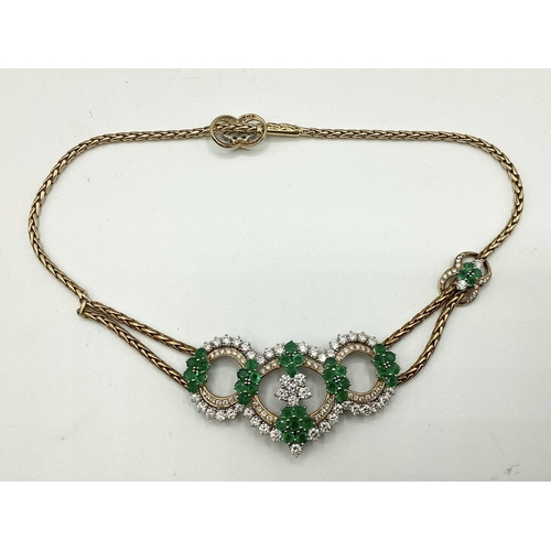 7 - An 18ct gold Emerald and diamond necklace. Retailed by Asprey's . Three articulated open work loops ... 