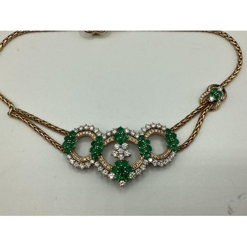 7 - An 18ct gold Emerald and diamond necklace. Retailed by Asprey's . Three articulated open work loops ... 