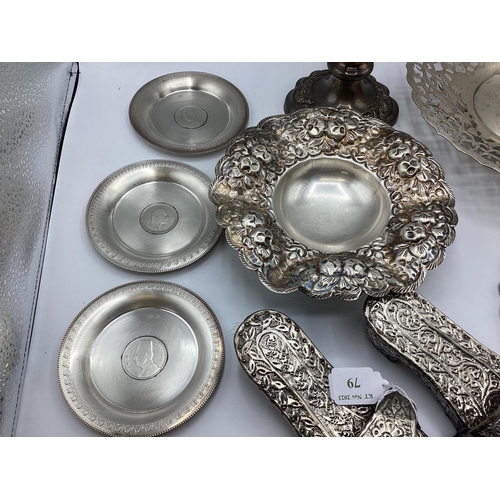 79 - A collection of Middle Eastern silver and unmarked metal items to include a pair of decorative slipp... 