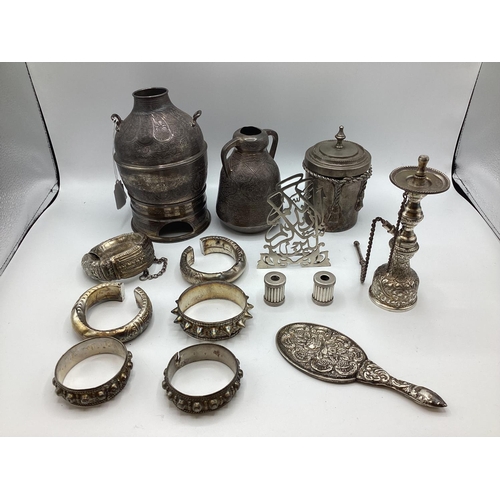 80 - A collection of Middle Eastern silver and white metal items to include ornamental water jugs, bangle... 