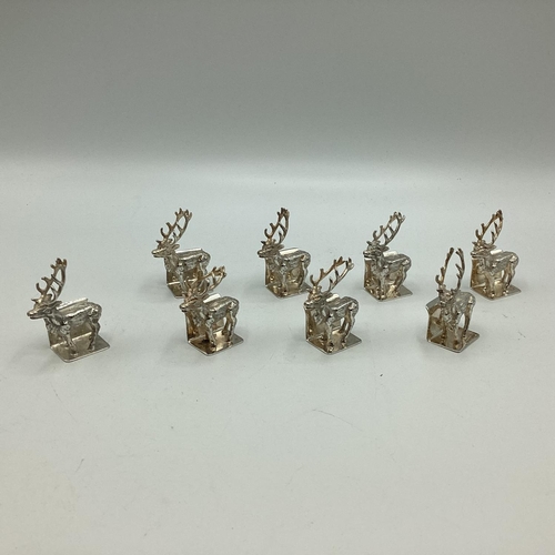 89 - A set of Sterling silver menu holders  of cast metal stags, by Camelot silver wear, Sheffield, 2004,... 