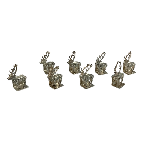 89 - A set of Sterling silver menu holders  of cast metal stags, by Camelot silver wear, Sheffield, 2004,... 