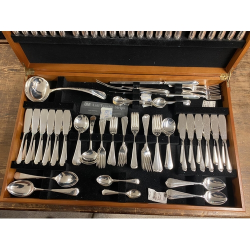 50 - A 12 piece Sheffield stainless steel cutlery set in original footed case.  Vendor paid £1,000.  In g... 