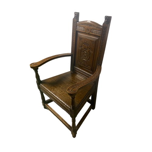 570 - A heavily carved oak armchair, 113cmH X 65cm Widest point