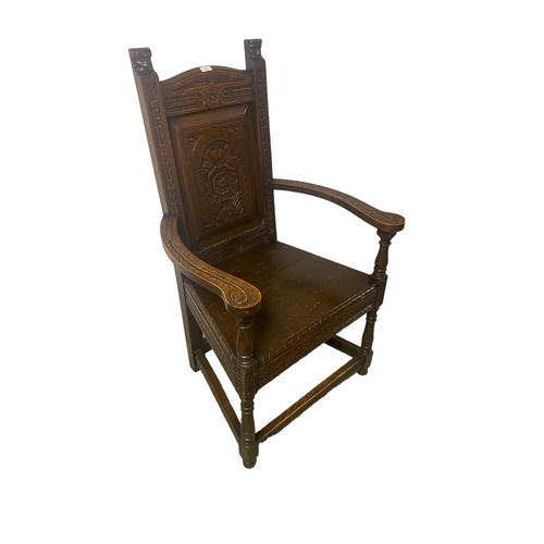 570 - A heavily carved oak armchair, 113cmH X 65cm Widest point