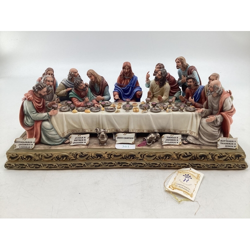 395 - A Capodimonte figural group. The Last Supper by Germano Cortese on a gilt plinth 2007/1566. signed t... 