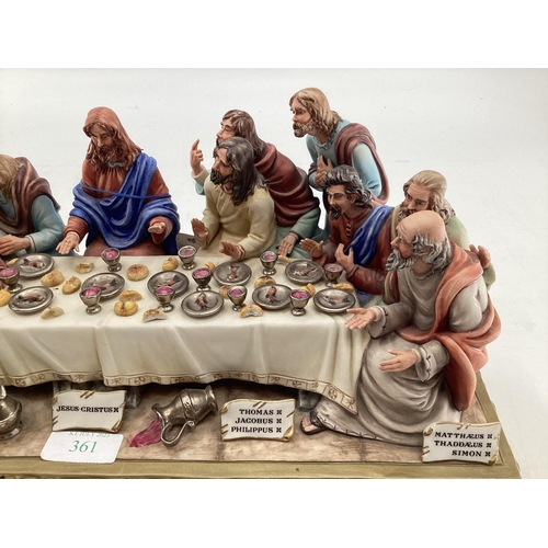 395 - A Capodimonte figural group. The Last Supper by Germano Cortese on a gilt plinth 2007/1566. signed t... 