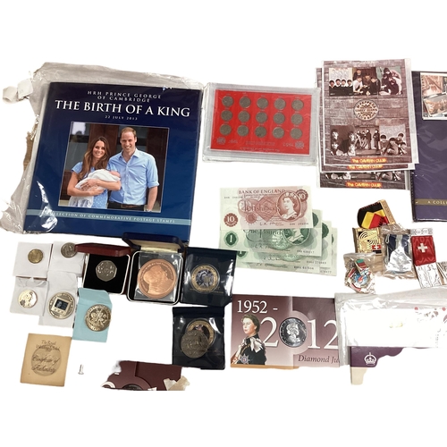 397 - A collection of 20th century commemorative and collectible coins and stamps and bank notes