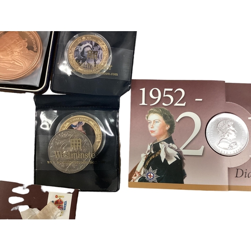 397 - A collection of 20th century commemorative and collectible coins and stamps and bank notes