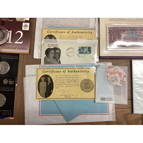 397 - A collection of 20th century commemorative and collectible coins and stamps and bank notes