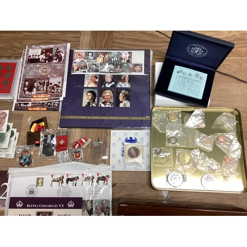 397 - A collection of 20th century commemorative and collectible coins and stamps and bank notes