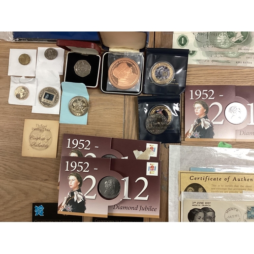 397 - A collection of 20th century commemorative and collectible coins and stamps and bank notes