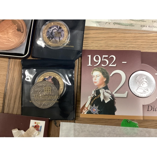 397 - A collection of 20th century commemorative and collectible coins and stamps and bank notes