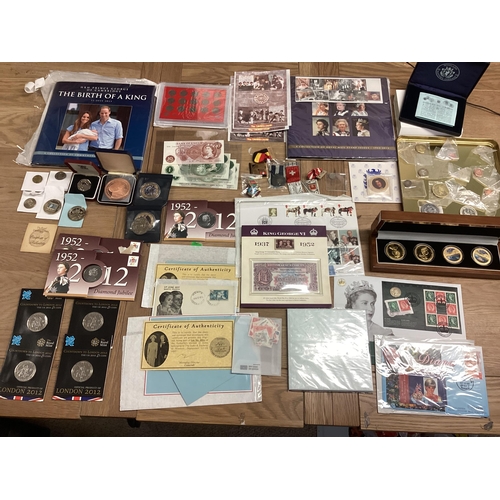 397 - A collection of 20th century commemorative and collectible coins and stamps and bank notes