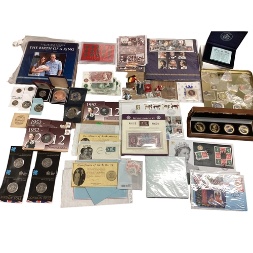 397 - A collection of 20th century commemorative and collectible coins and stamps and bank notes