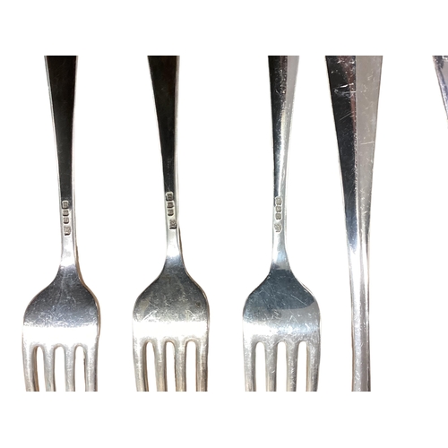 94 - A six person sterling silver flatware service together with sterling silver handled knives . William... 