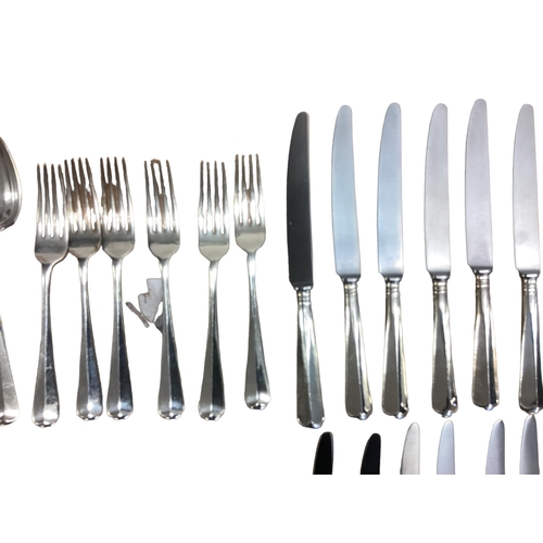 94 - A six person sterling silver flatware service together with sterling silver handled knives . William... 