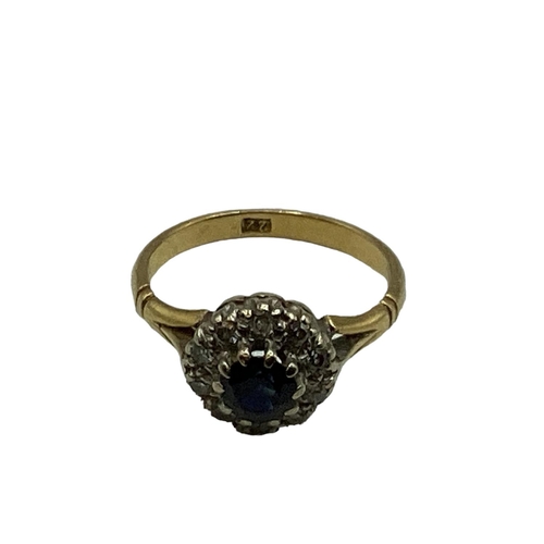 10 - A 22ct gold sapphire and diamond ring, central round cut sapphire with a surround of single cut diam... 