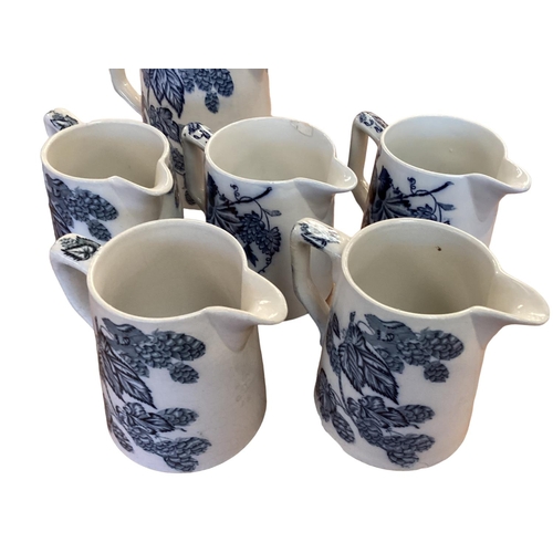 106 - A set of Staffordshire blue and white graduated jugs together and other items.