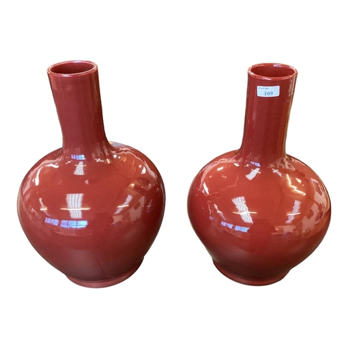 109 - A large pair of modern sang de Boeuf style waisted vases. 43cm(h)