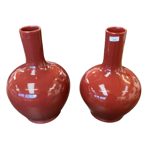 109 - A large pair of modern sang de Boeuf style waisted vases. 43cm(h)