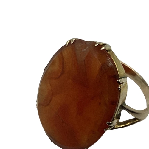 12 - An unmarked yellow metal carnelian set dress ring. 2.55g. Size P